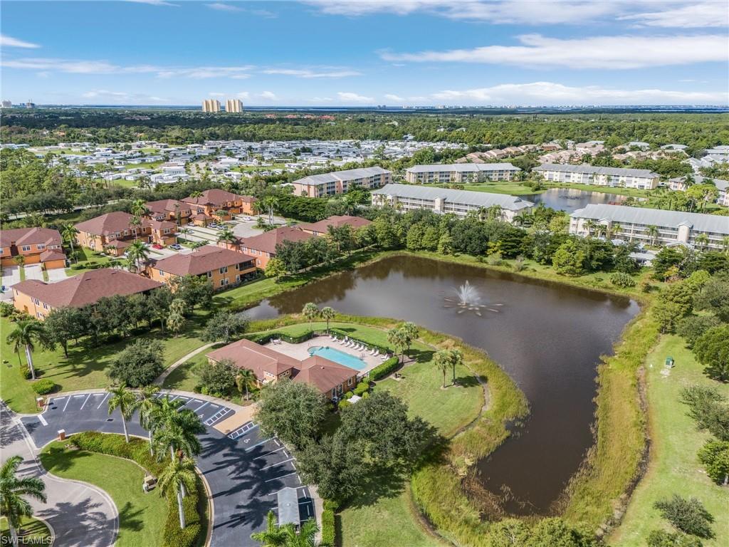 3732 Pino Vista Way, Unit 2 Estero, FL 33928 - Photo 27 of 29 an aerial view of residential houses with outdoor space and lake view in back