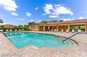 3732 Pino Vista Way, Unit 2 Estero, FL 33928 - Photo 28 of 29 a view of a house with a swimming pool