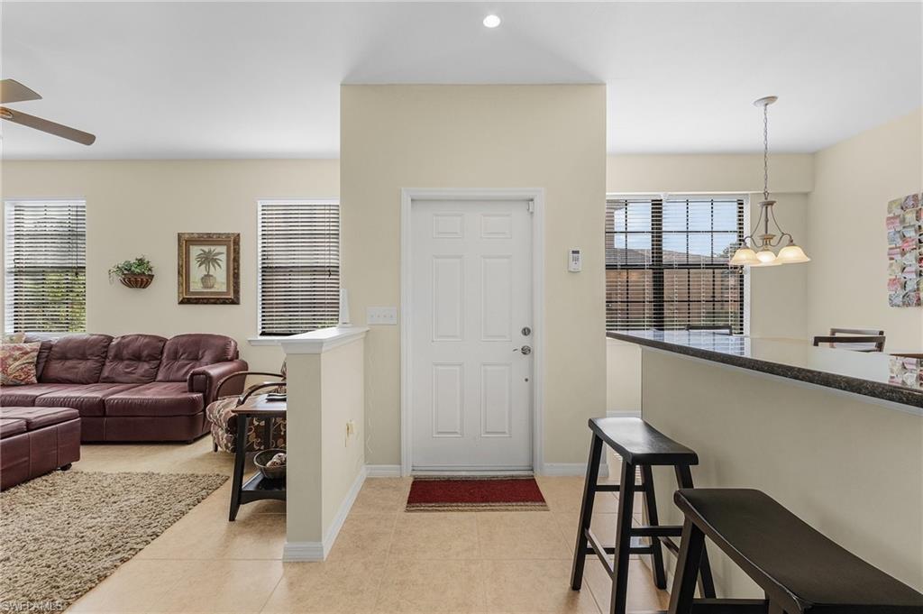 3732 Pino Vista Way, Unit 2 Estero, FL 33928 - Photo 3 of 29 a living room with furniture and a window