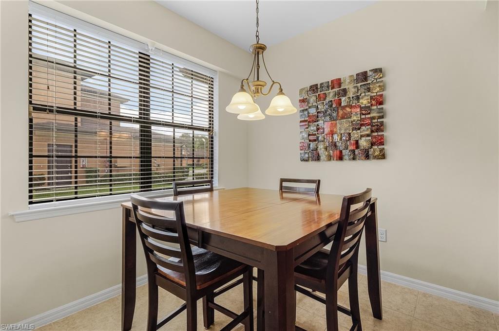 3732 Pino Vista Way, Unit 2 Estero, FL 33928 - Photo 7 of 29 a view of a dining room with furniture and window