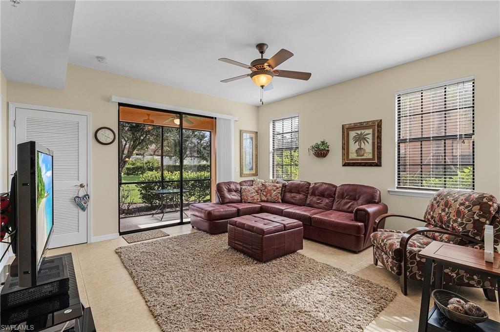 3732 Pino Vista Way, Unit 2 Estero, FL 33928 - Photo 10 of 29 a living room with furniture and a flat screen tv