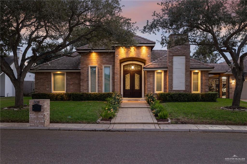 809 Rio Grande Drive Mission, TX 78572 - Photo 1 of 45 front view of a house with a small yard