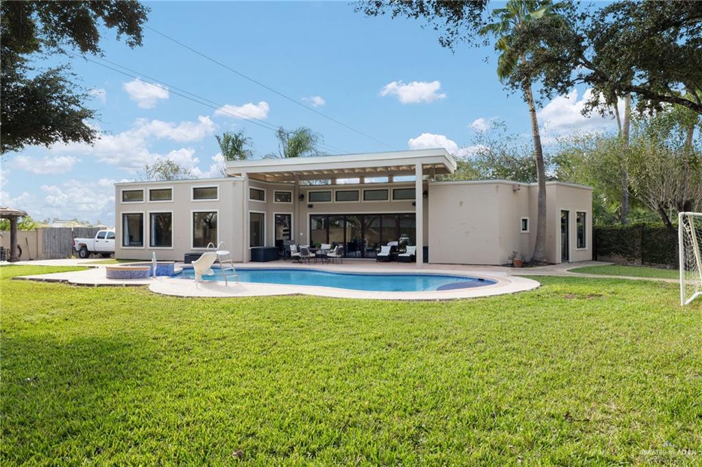 809 Rio Grande Drive Mission, TX 78572 - Photo 28 of 45 a view of a house with swimming pool and sitting area