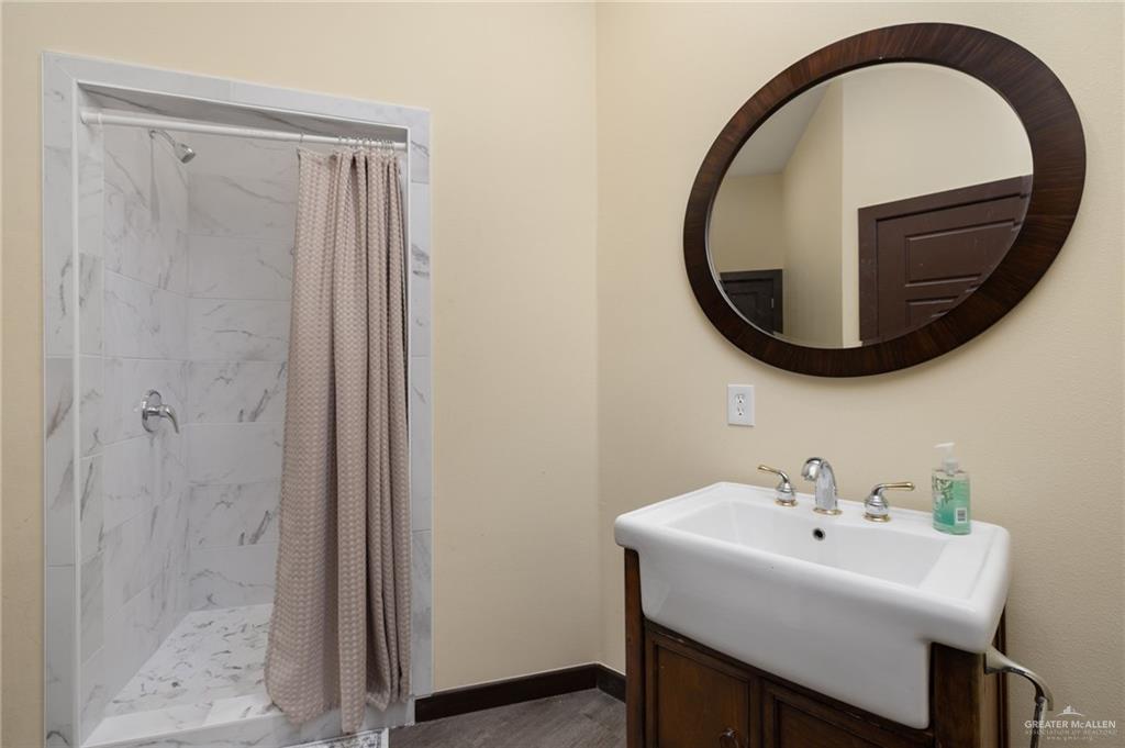 809 Rio Grande Drive Mission, TX 78572 - Photo 34 of 45 a bathroom with a sink and a mirror