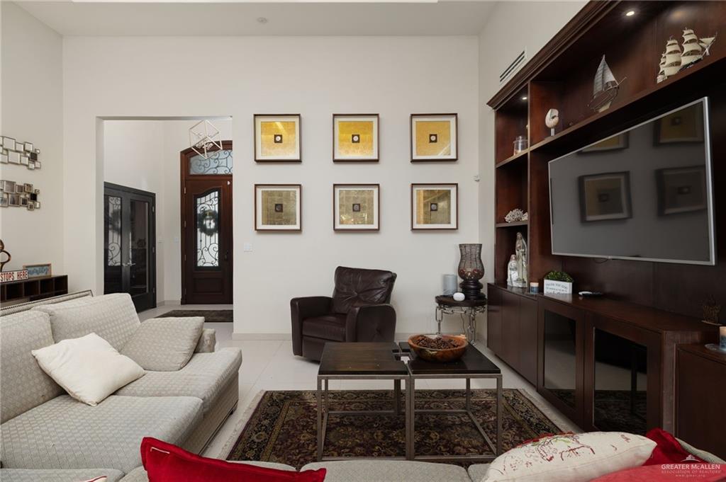 809 Rio Grande Drive Mission, TX 78572 - Photo 6 of 45 a living room with furniture and a flat screen tv