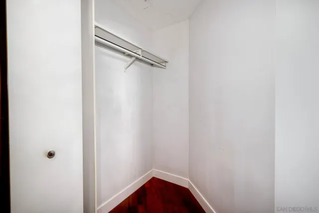 a living room with furniture and a dining table