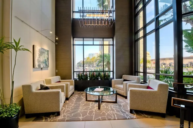 a living room with furniture a fireplace and windows