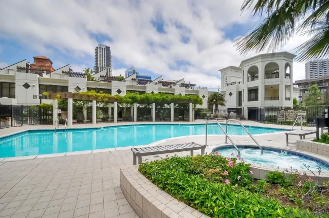 a view of staircase with white walls and a window