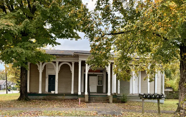 a front view of a house with a yard