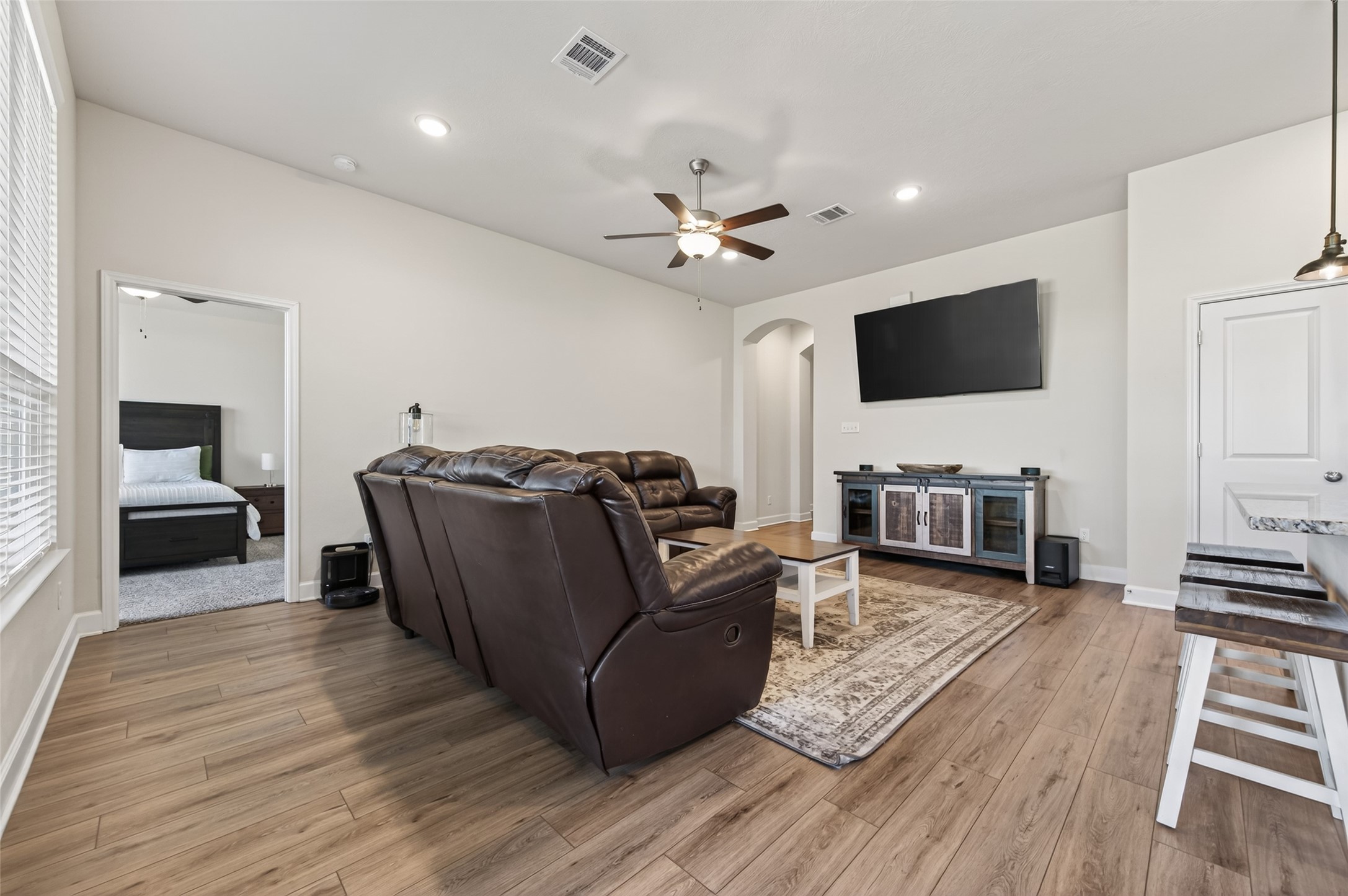 917 Farm Path Brenham, TX 77833 - Photo 8 of 43 a living room with furniture and a flat screen tv