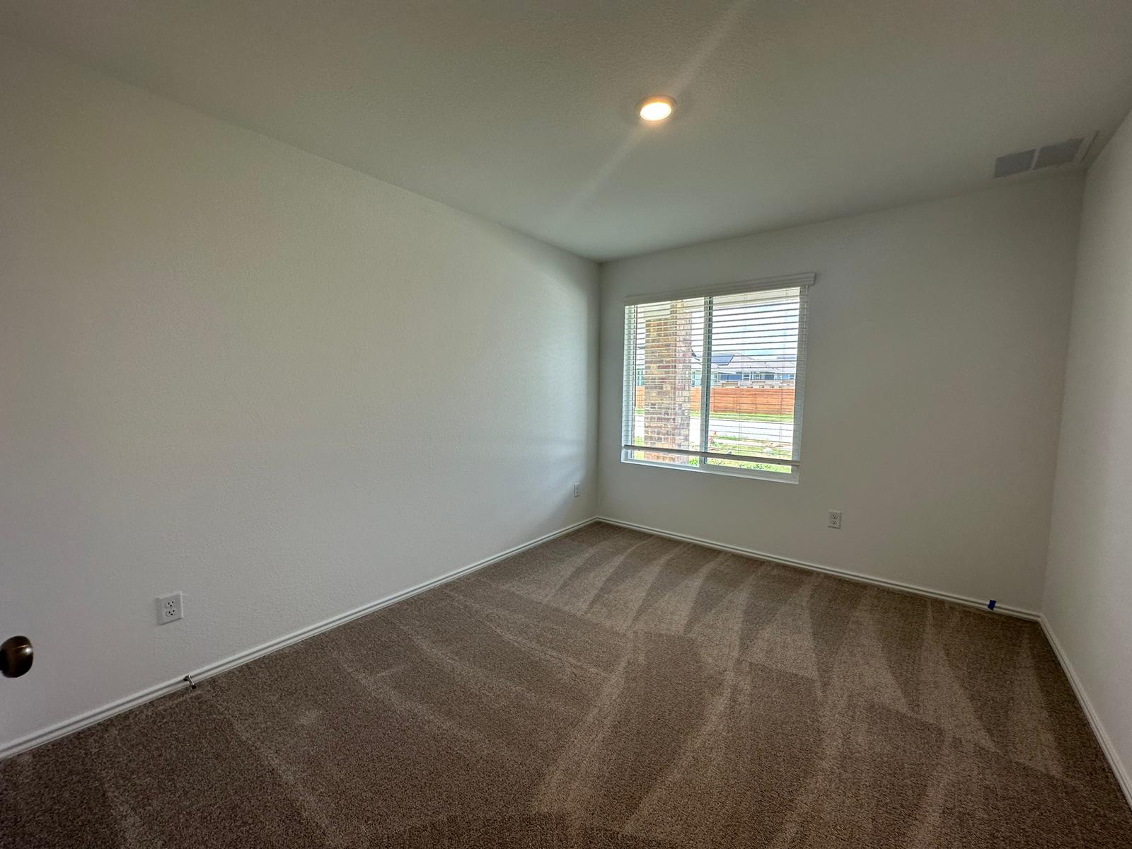1594 Marley Kyle, TX 78640 - Photo 12 of 34 an empty room with a window