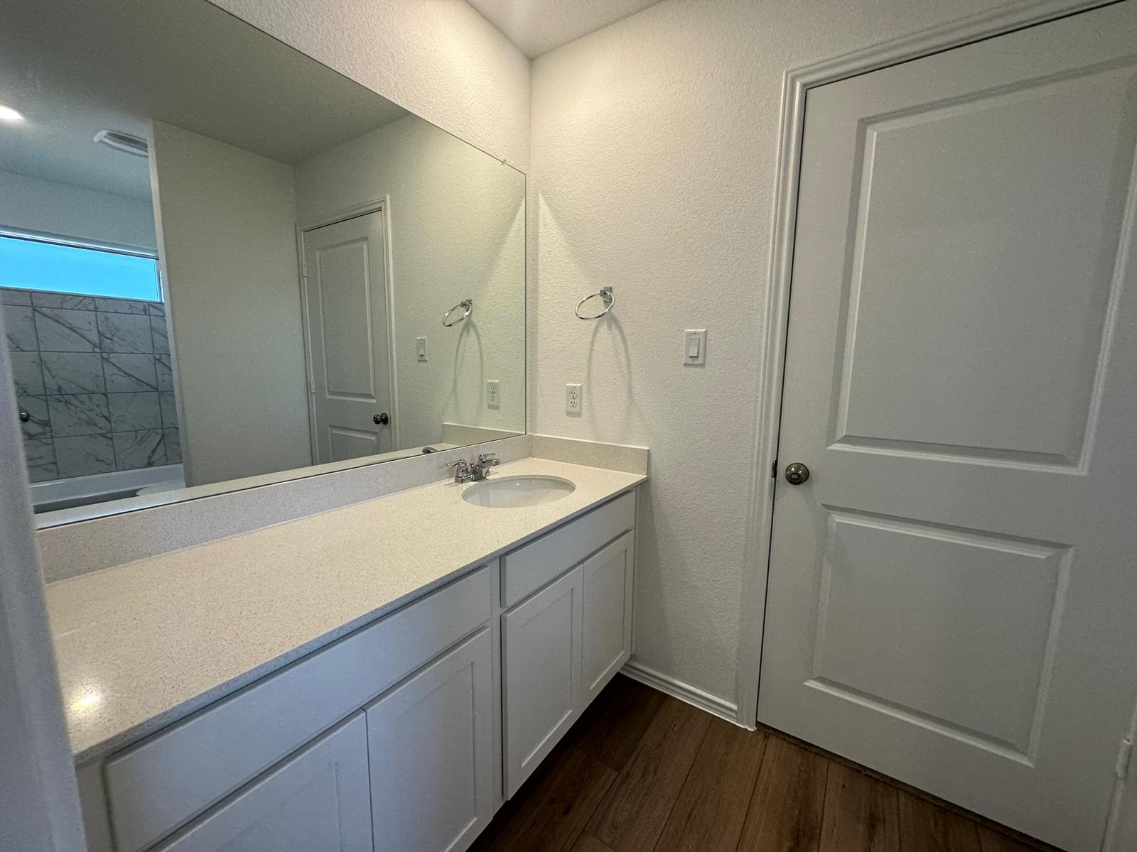 1594 Marley Kyle, TX 78640 - Photo 22 of 34 a bathroom with a sink and mirror