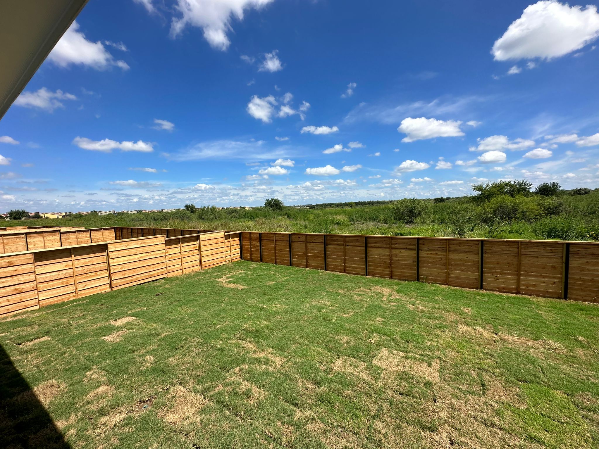 1594 Marley Kyle, TX 78640 - Photo 31 of 34 a view of a backyard with a garden