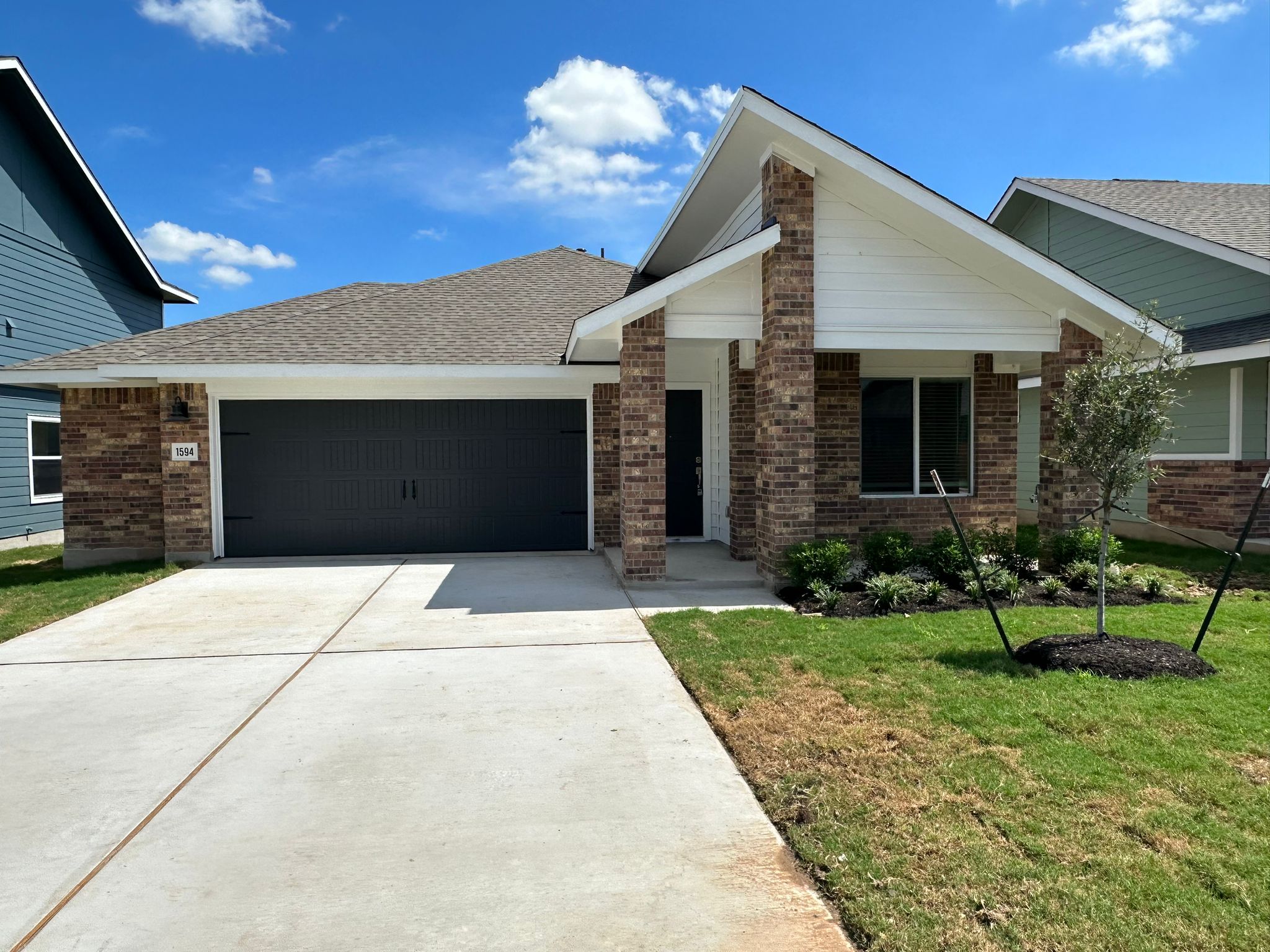 1594 Marley Kyle, TX 78640 - Photo 8 of 34 a front view of a house with a yard