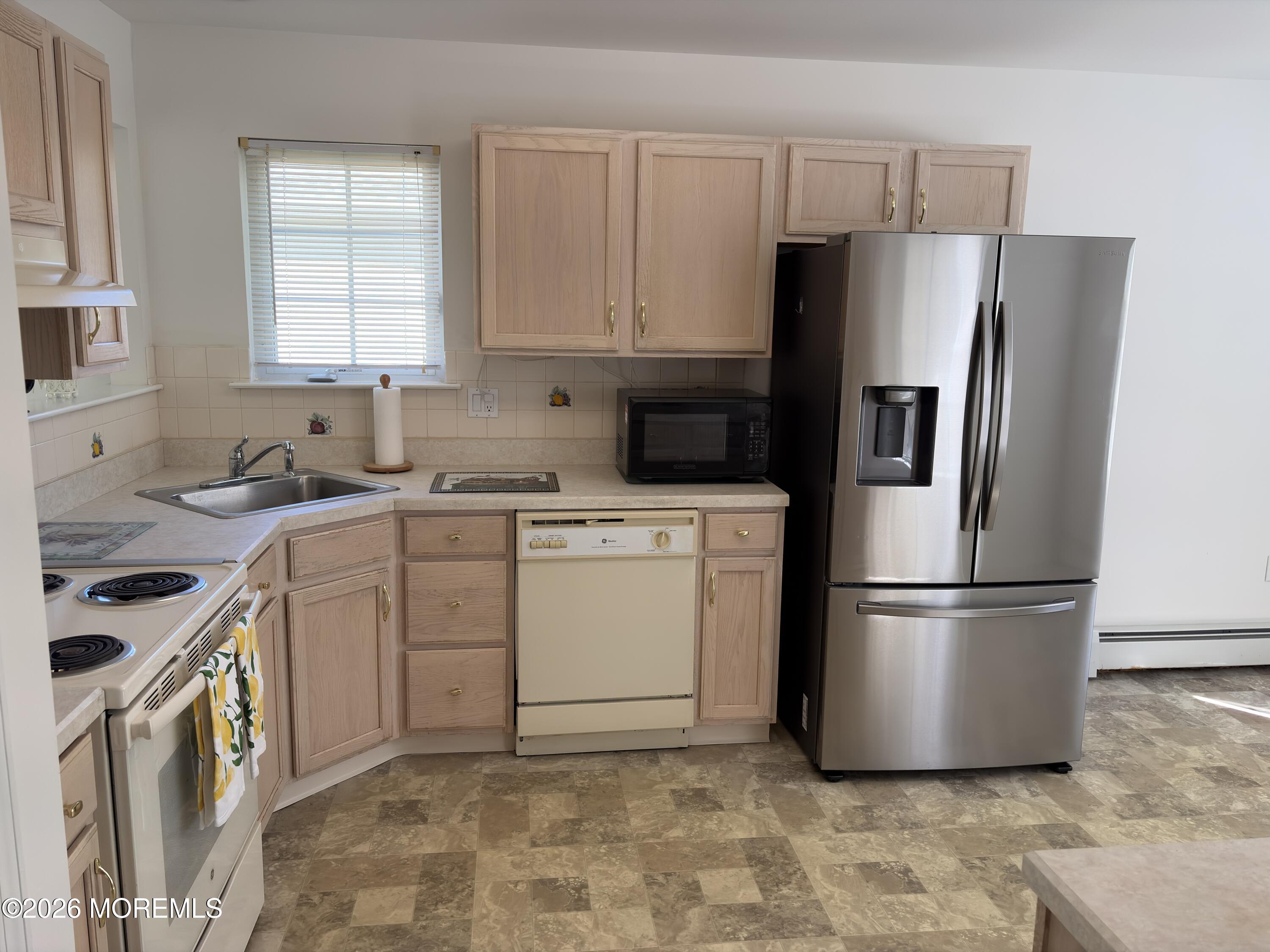 35 Meadows Lane Whiting, NJ 08759 - Photo 5 of 23 a kitchen with a refrigerator sink and cabinets