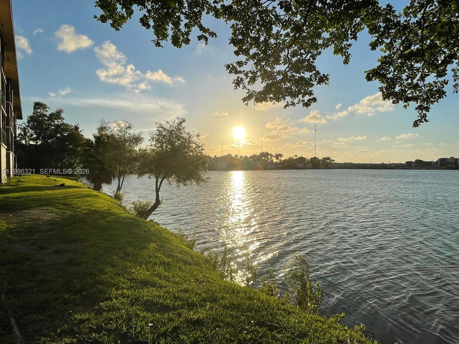 a view of a lake with a yard