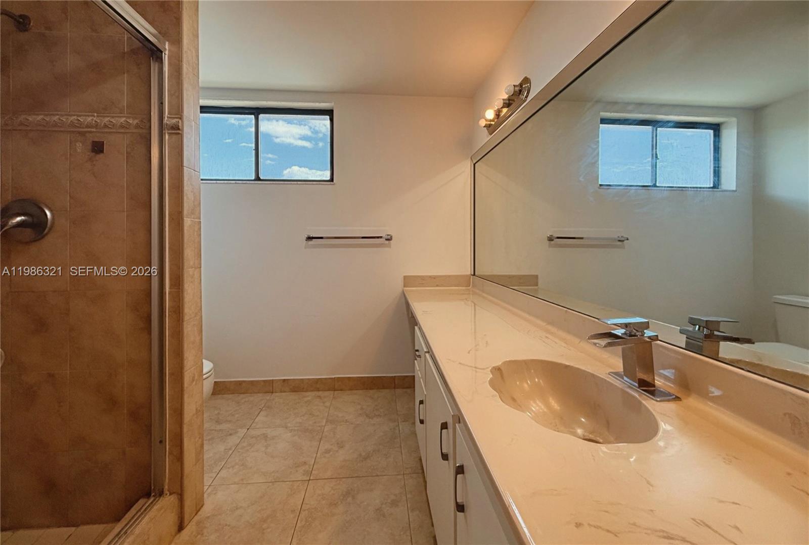 511 Ives Dairy Road, Unit 3016 Miami, FL 33179 - Photo 18 of 72 a bathroom with a sink and a tub