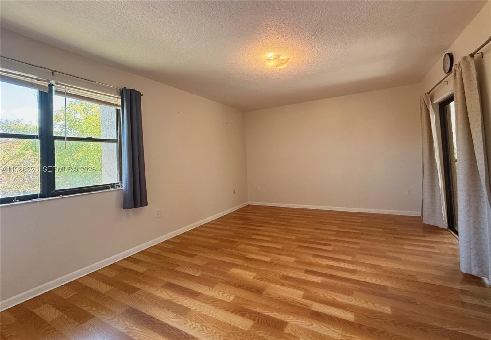 511 Ives Dairy Road, Unit 3016 Miami, FL 33179 - Photo 24 of 72 a view of an empty room with a window