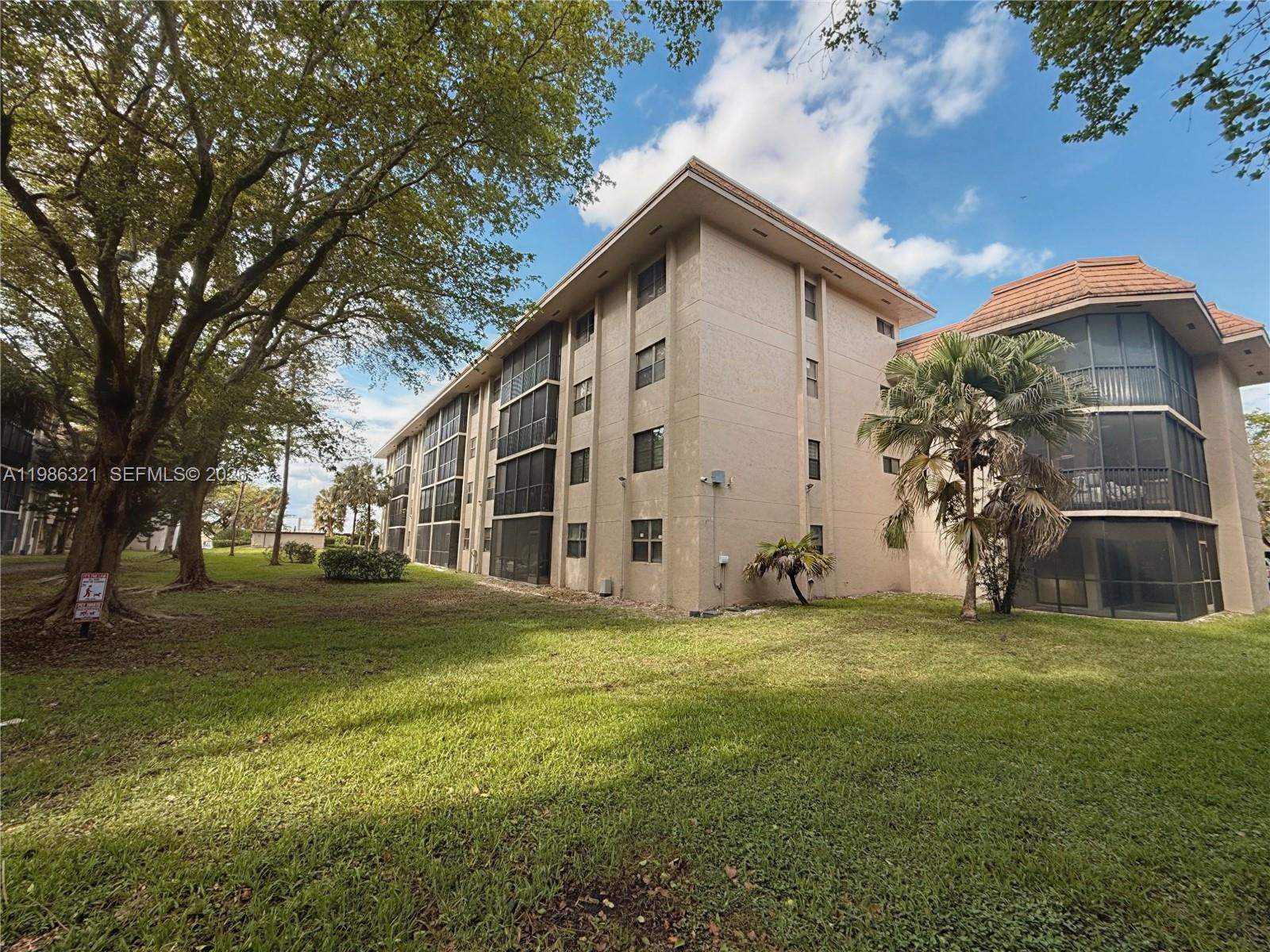 511 Ives Dairy Road, Unit 3016 Miami, FL 33179 - Photo 40 of 72 a view of a house with a yard