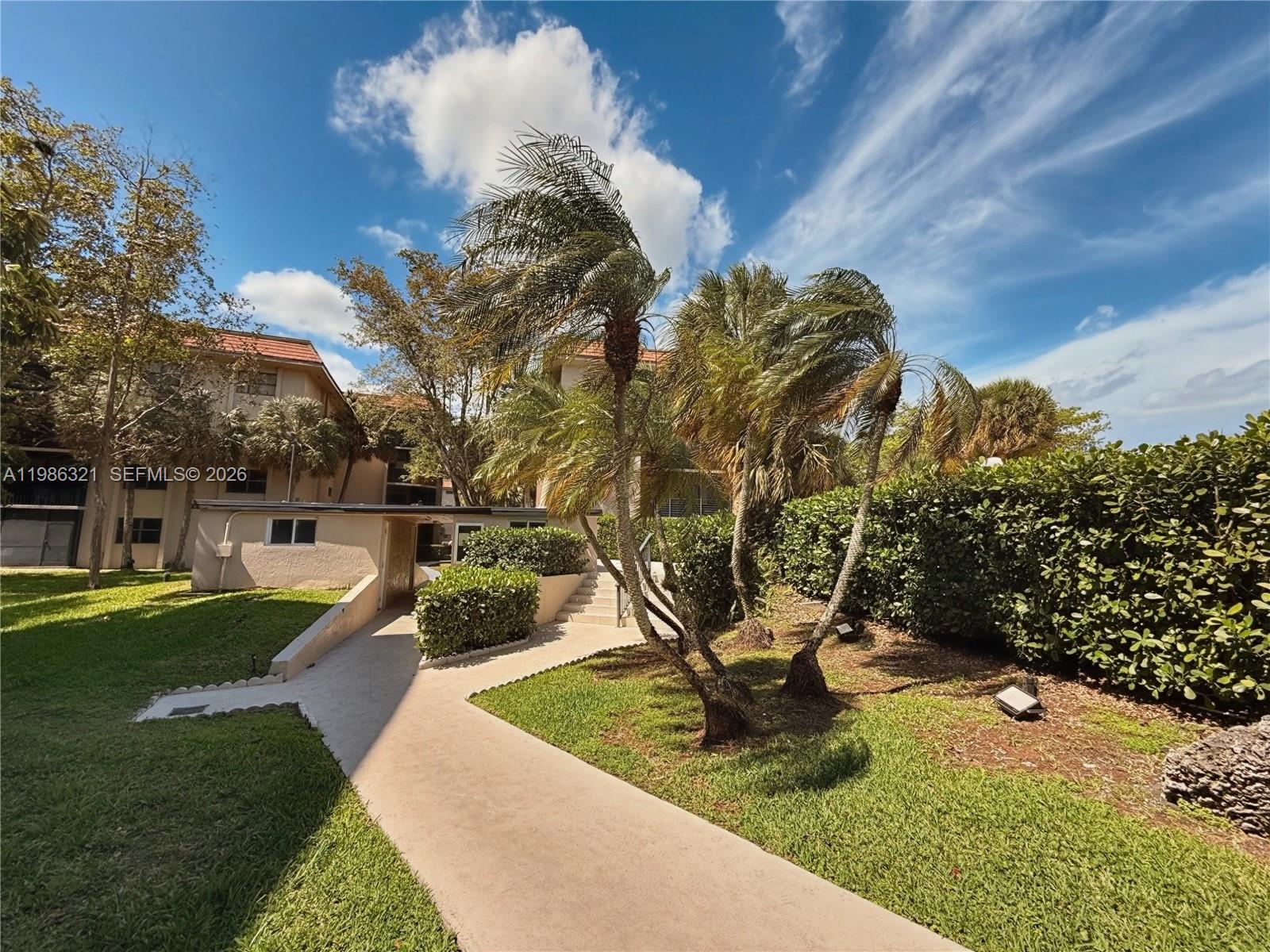 511 Ives Dairy Road, Unit 3016 Miami, FL 33179 - Photo 41 of 72 a view of a garden