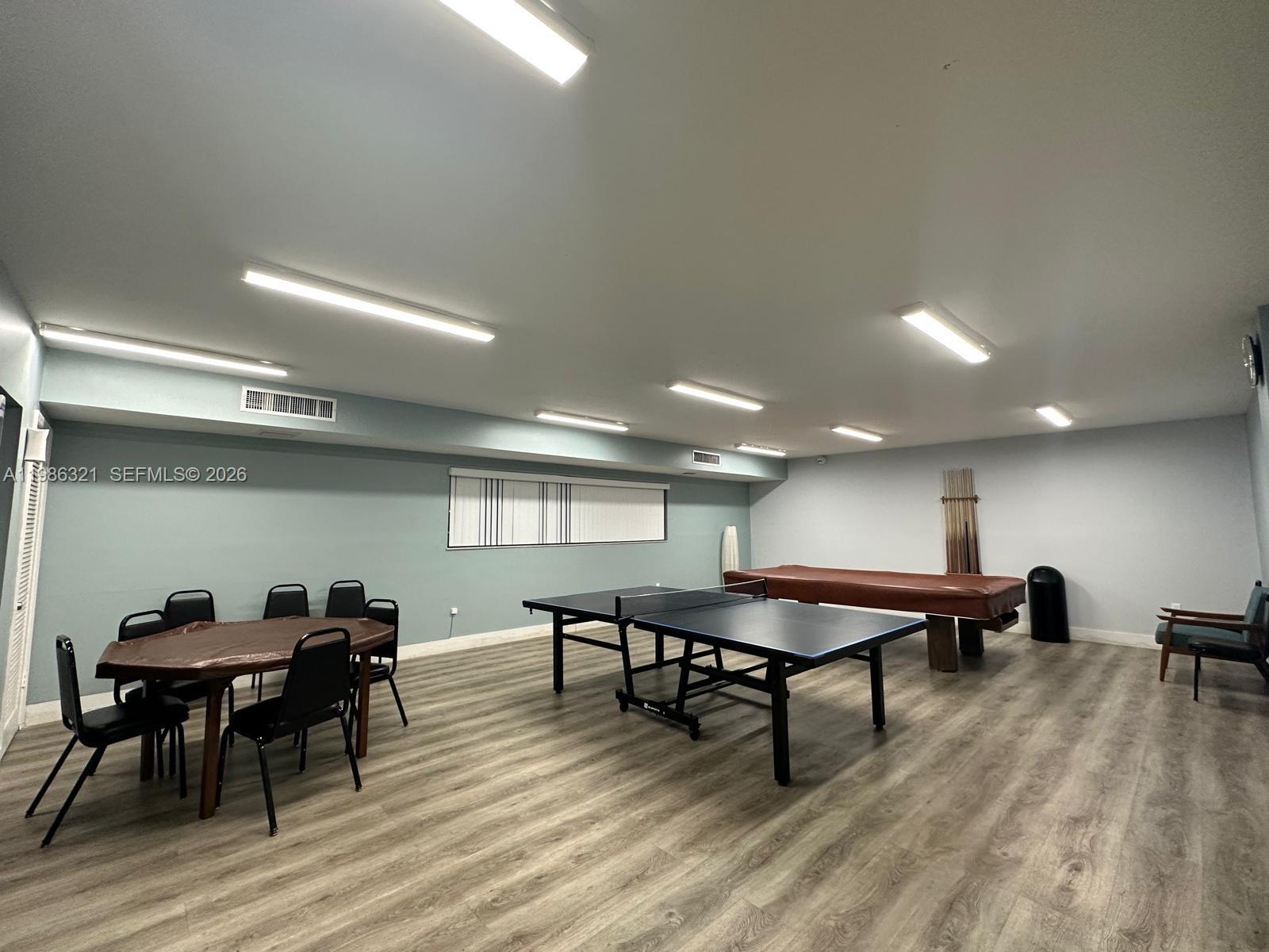 511 Ives Dairy Road, Unit 3016 Miami, FL 33179 - Photo 68 of 72 a view of a a dining room with furniture window and wooden floor