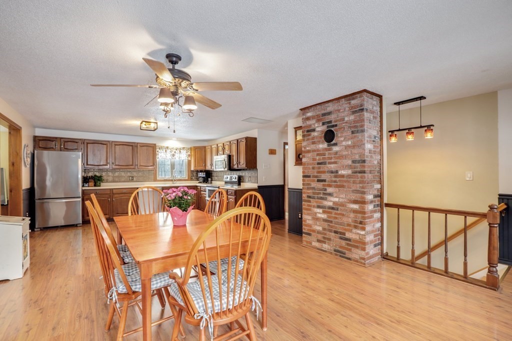 a dining room with furniture and wooden floor