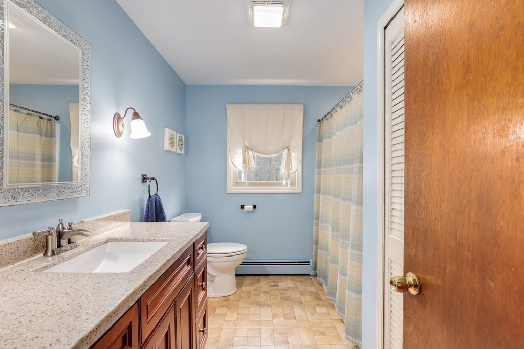 70 R Milk Street Blackstone, MA 01504 - Photo 14 of 40 a bathroom with a sink and a mirror