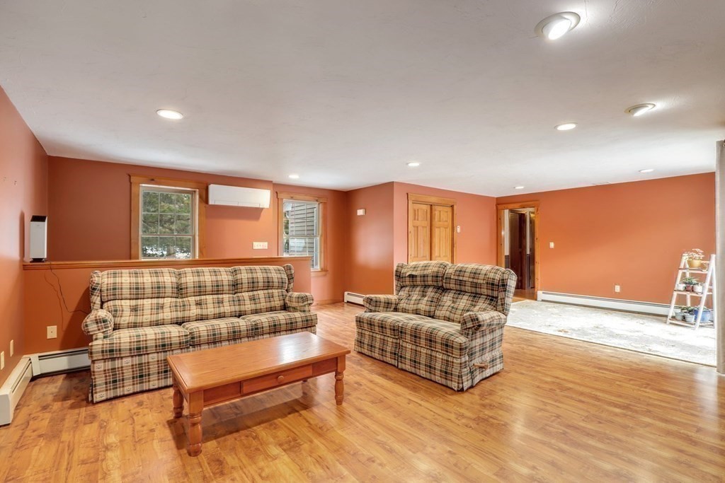 70 R Milk Street Blackstone, MA 01504 - Photo 17 of 40 a living room with furniture and a flat screen tv