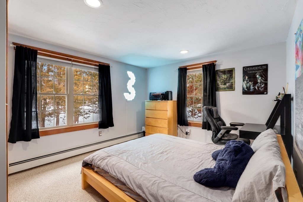 70 R Milk Street Blackstone, MA 01504 - Photo 24 of 40 a bedroom with a bed window and dresser