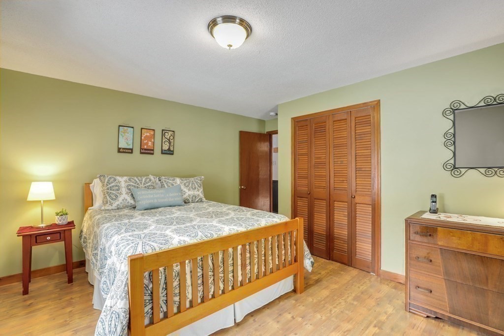 70 R Milk Street Blackstone, MA 01504 - Photo 27 of 40 a bedroom with a bed and a dresser