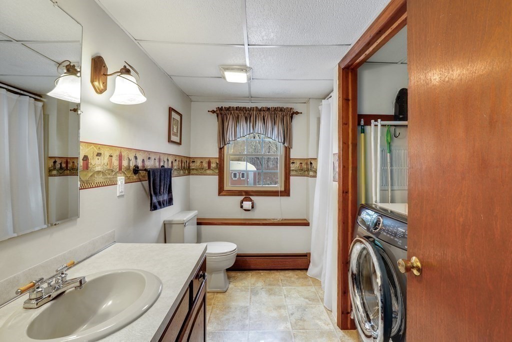 70 R Milk Street Blackstone, MA 01504 - Photo 31 of 40 a bathroom with a sink a bathtub and shower