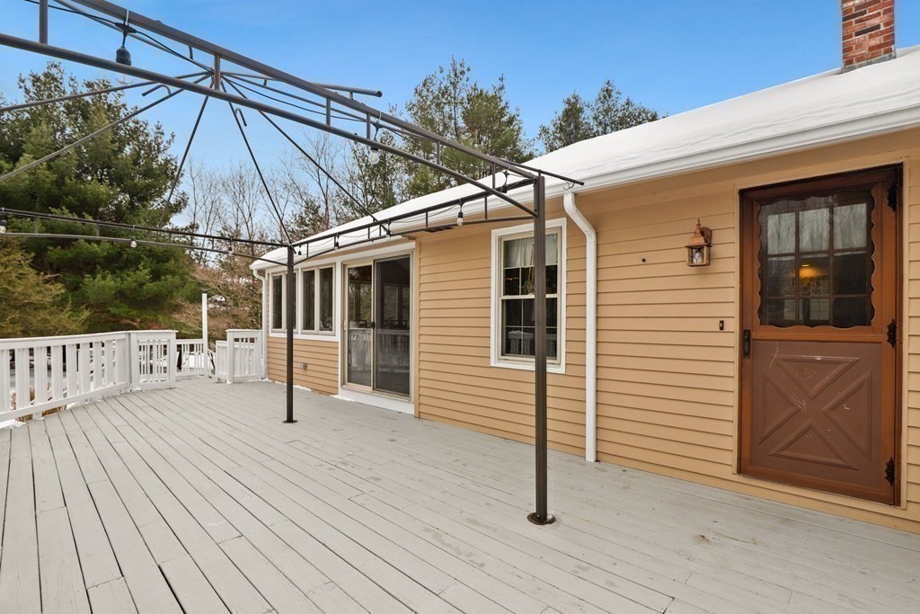 70 R Milk Street Blackstone, MA 01504 - Photo 34 of 40 a view of a house with a wooden deck
