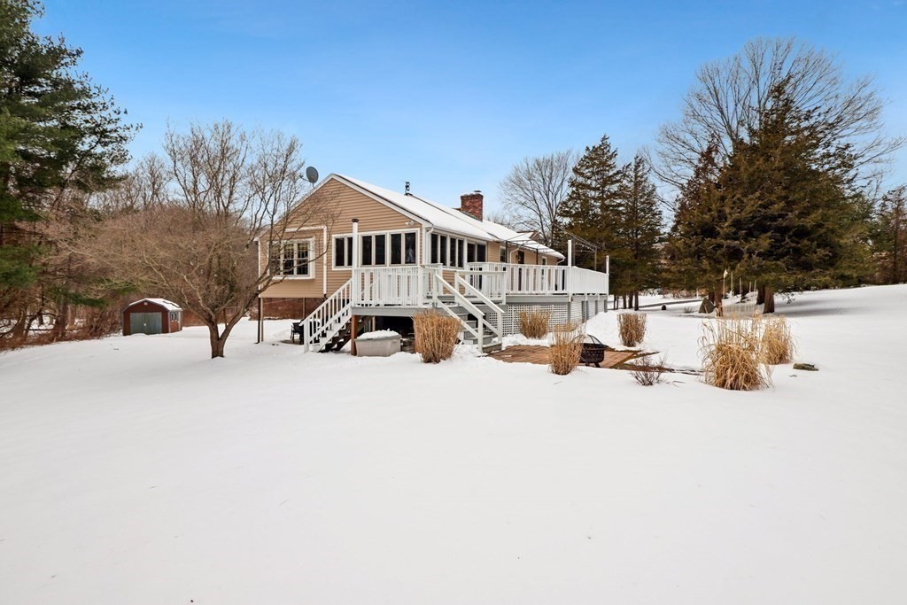 70 R Milk Street Blackstone, MA 01504 - Photo 36 of 40 a view of a house with a snow in the yard