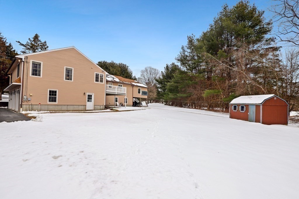 70 R Milk Street Blackstone, MA 01504 - Photo 39 of 40 a white house with a large tree in front of it