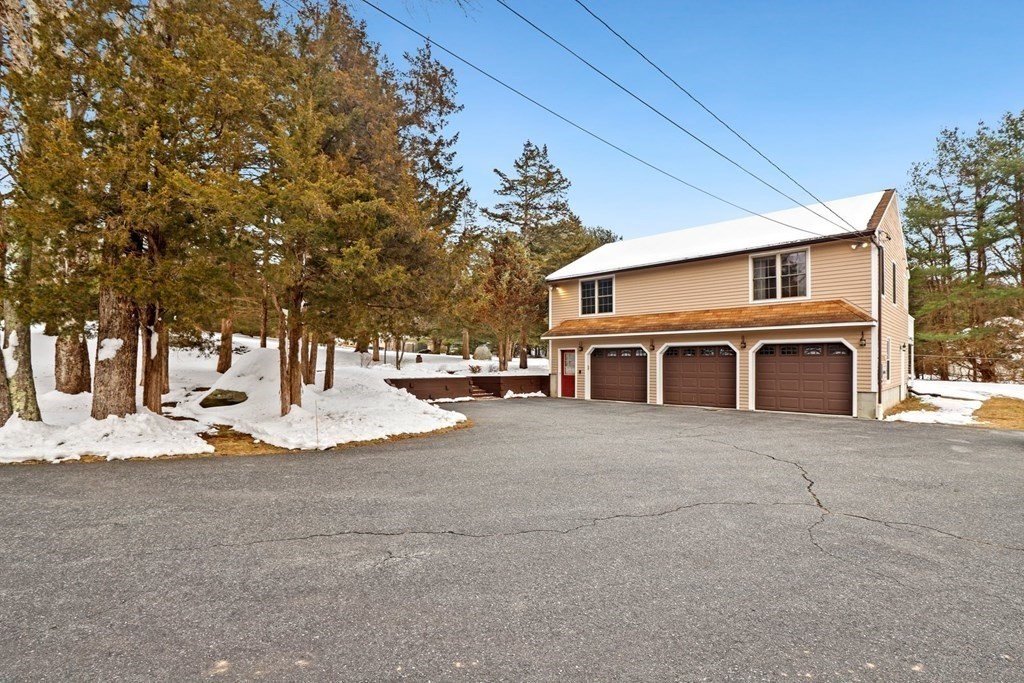 70 R Milk Street Blackstone, MA 01504 - Photo 4 of 40 a front view of a house with a yard
