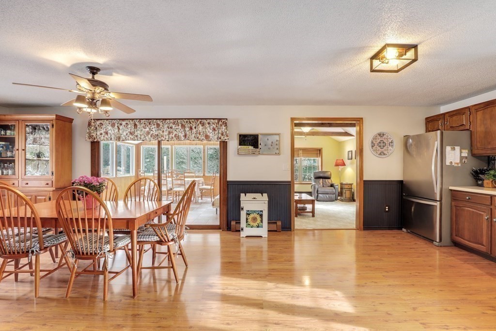 70 R Milk Street Blackstone, MA 01504 - Photo 9 of 40 a view of a dining room with furniture a chandelier and wooden floor