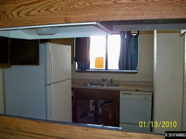 15024 Humite Lane Reno, NV 89506 - Photo 3 of 8 a view of a bathroom with a sink and mirror
