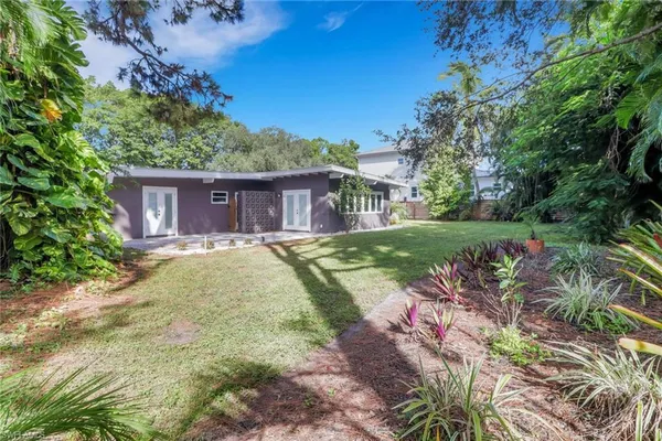 a view of a house with a yard
