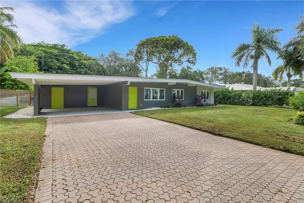 front view of a house with a yard