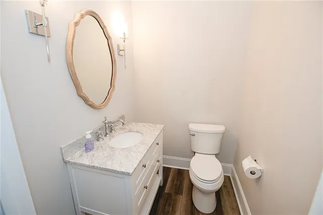 a large bathroom with a granite countertop sink mirror and a bath tub