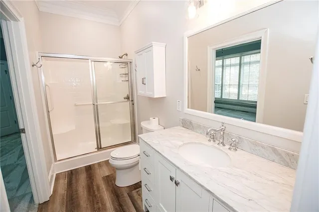 a large spacious bathroom with double vanity sink a mirror a bathtub and window