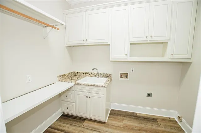 a spacious bathroom with a double vanity sink mirror and bathtub