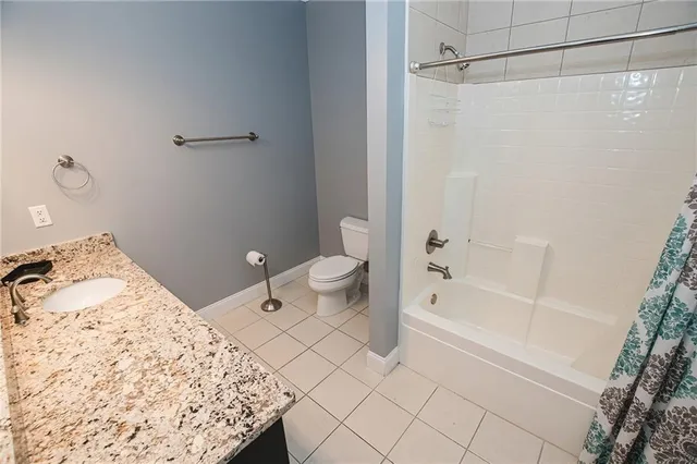 a backyard of a house with lots of green space and fountain