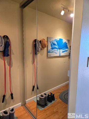 a room with gym equipment and a mirror