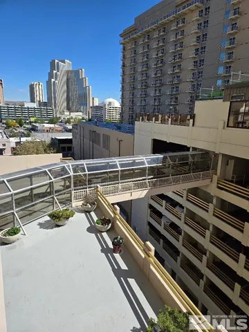 a kitchen with stainless steel appliances a cabinets and wooden floor