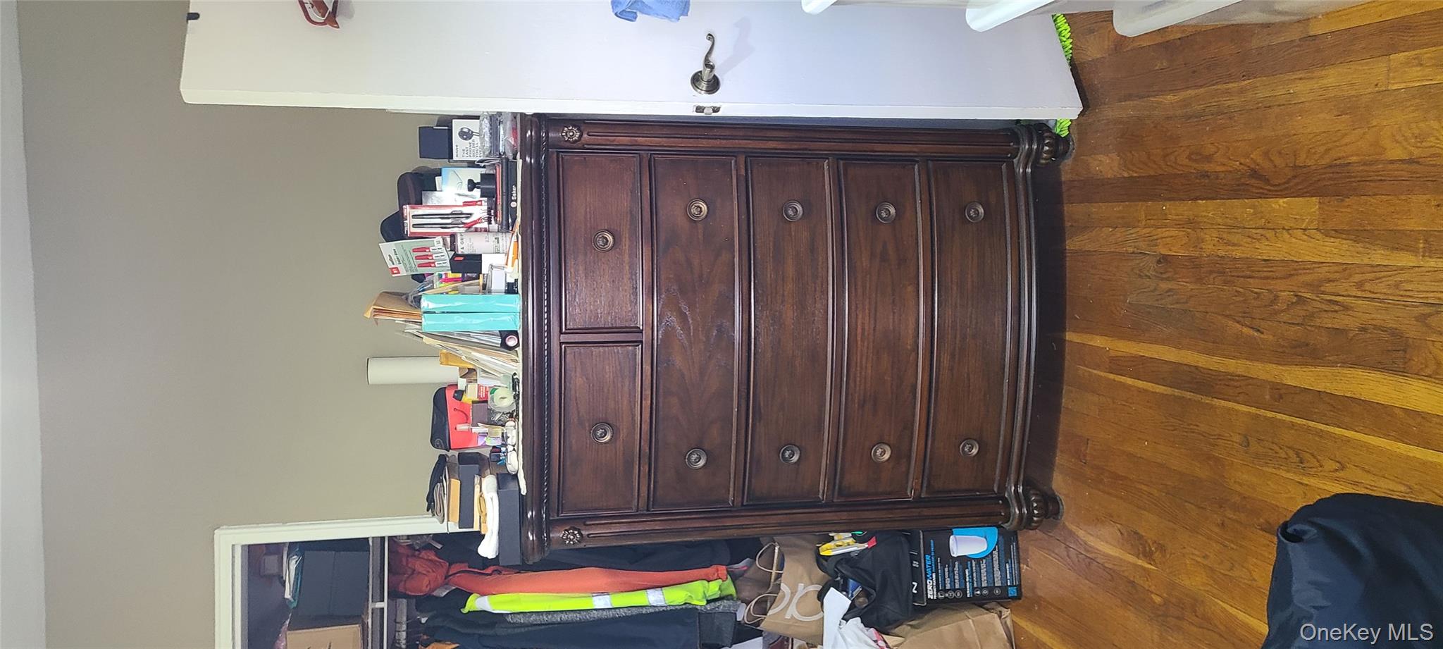 73-54 Springfield Boulevard, Unit 54A2 Queens, NY 11364 - Photo 6 of 11 a view of a dresser