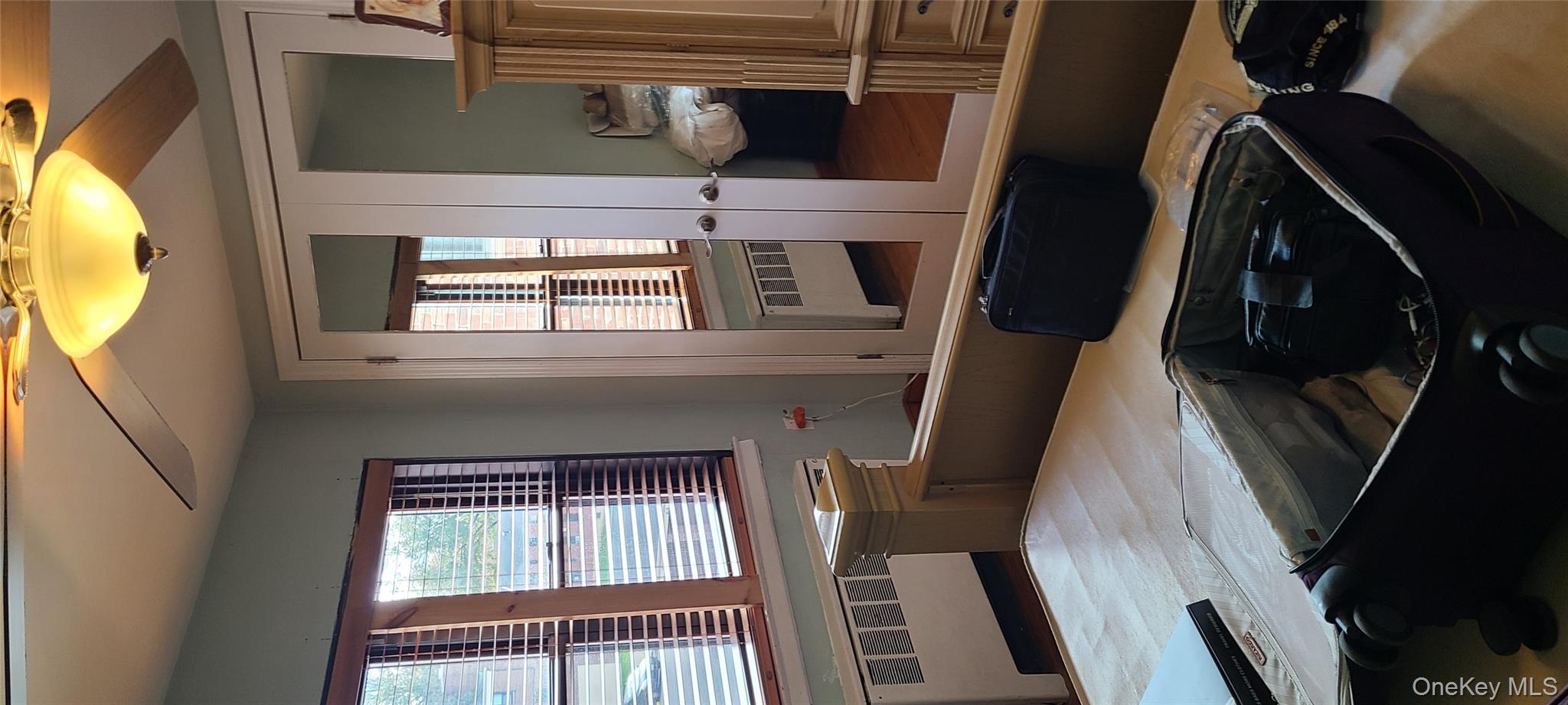 73-54 Springfield Boulevard, Unit 54A2 Queens, NY 11364 - Photo 7 of 11 a kitchen that has a sink and a stove