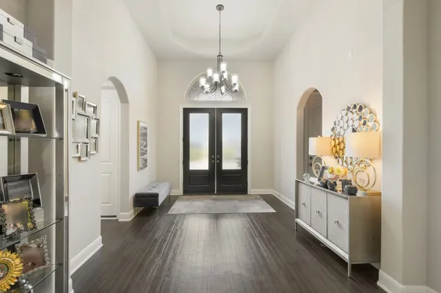 a view of a hallway view with wooden floor and staircase