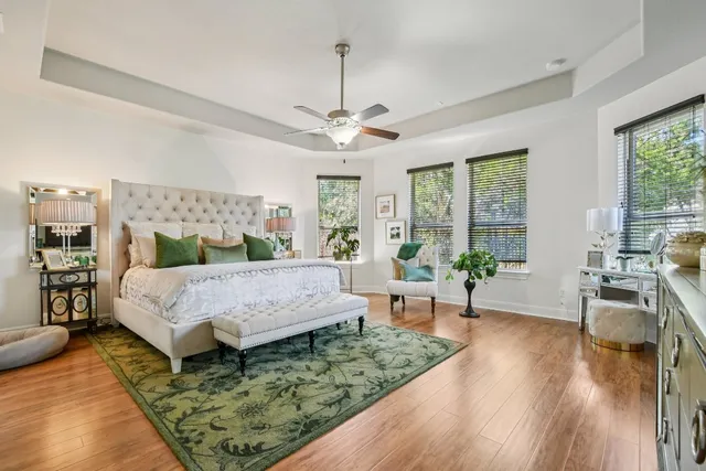 a bed room with a bed a couch and a window