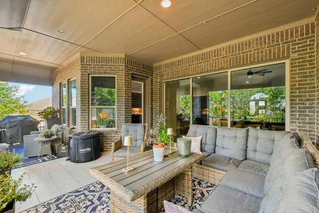 a outdoor space with patio the couches and a dining table with garden view